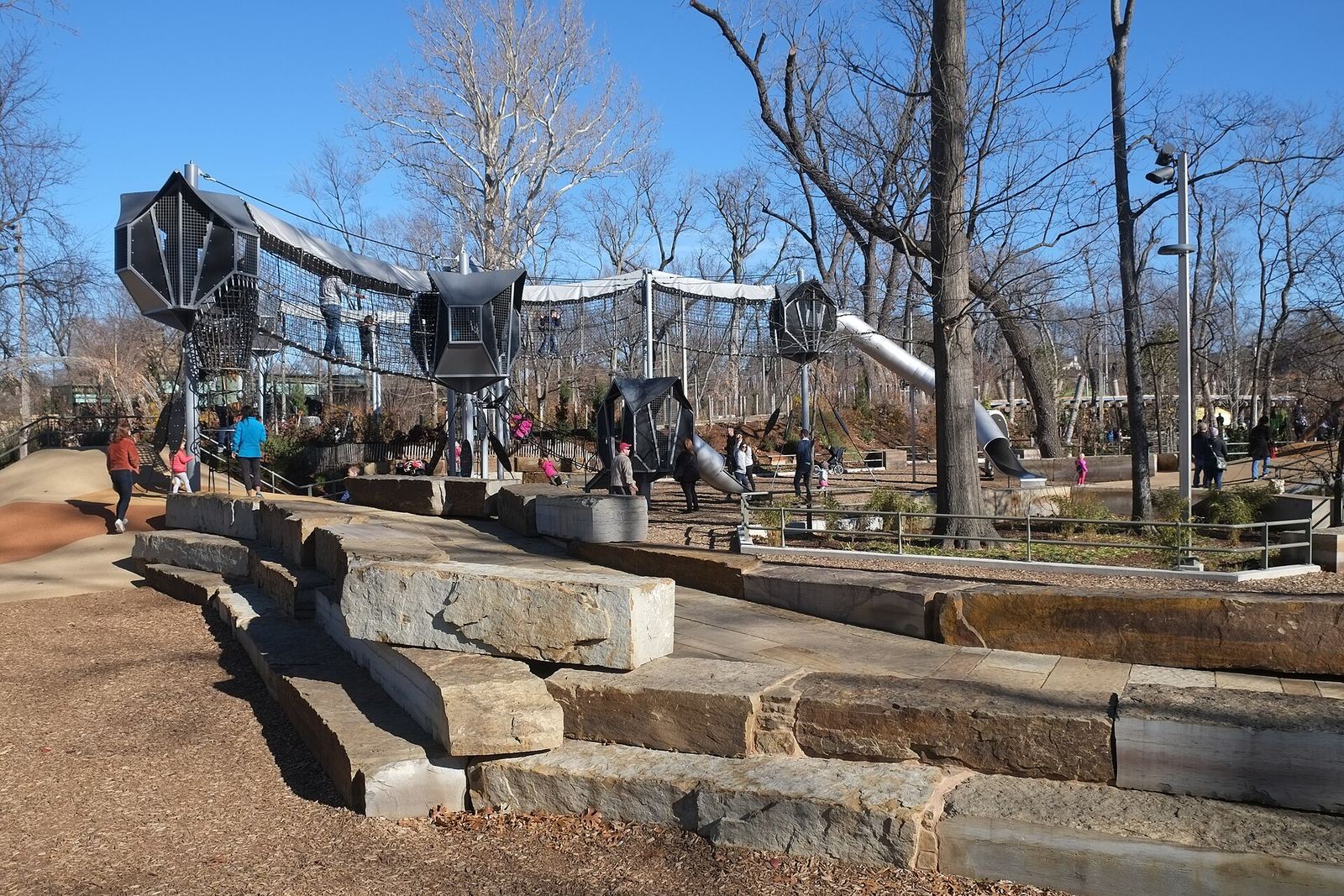 The Gathering Place: stepped stone seating facing the adventure playground