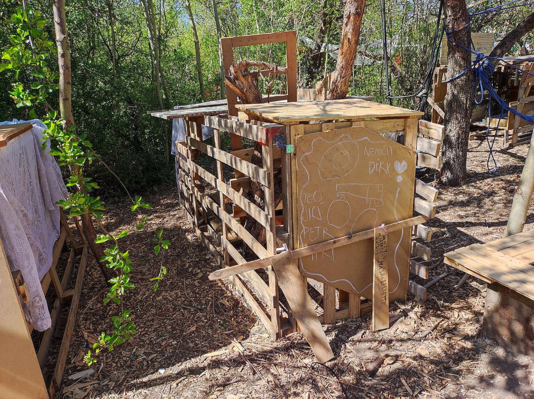 Vypich Adventure Playground, Prague: pallet den among trees
