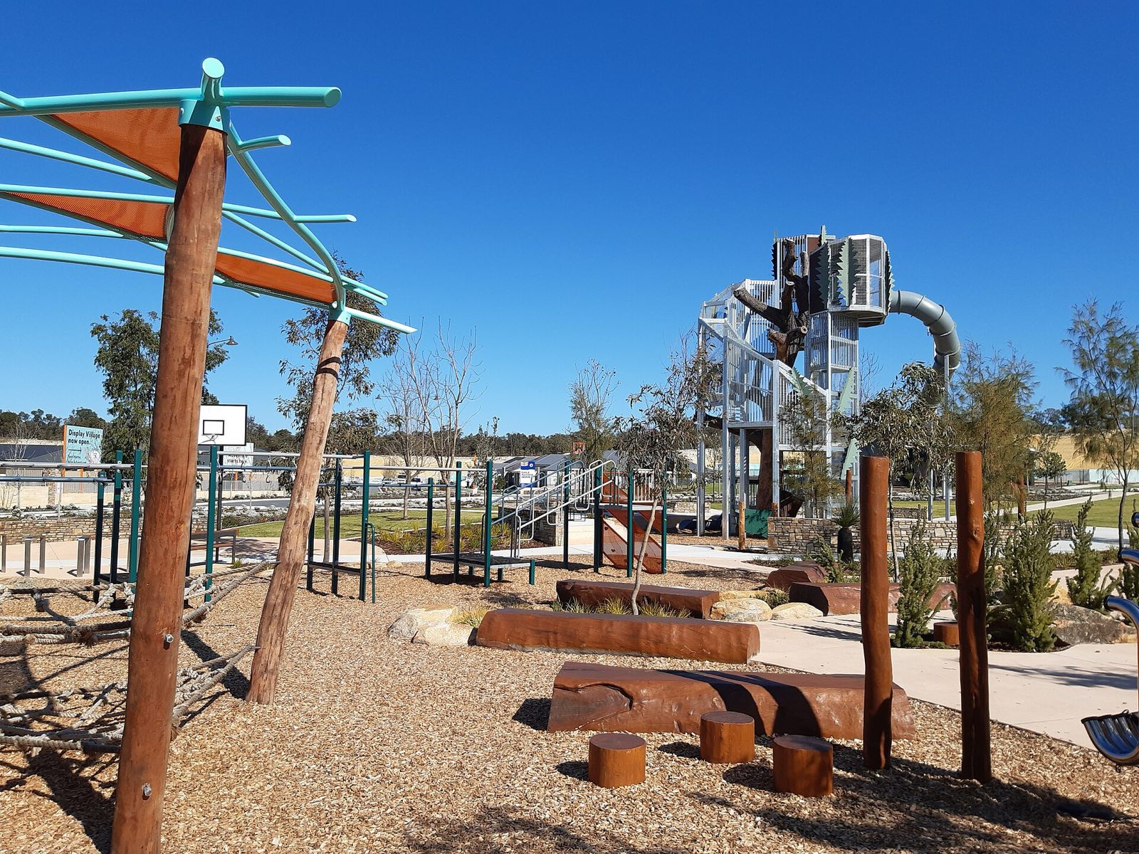Mokare Reserve adventure playground: nets, log steps and a tall slide tower