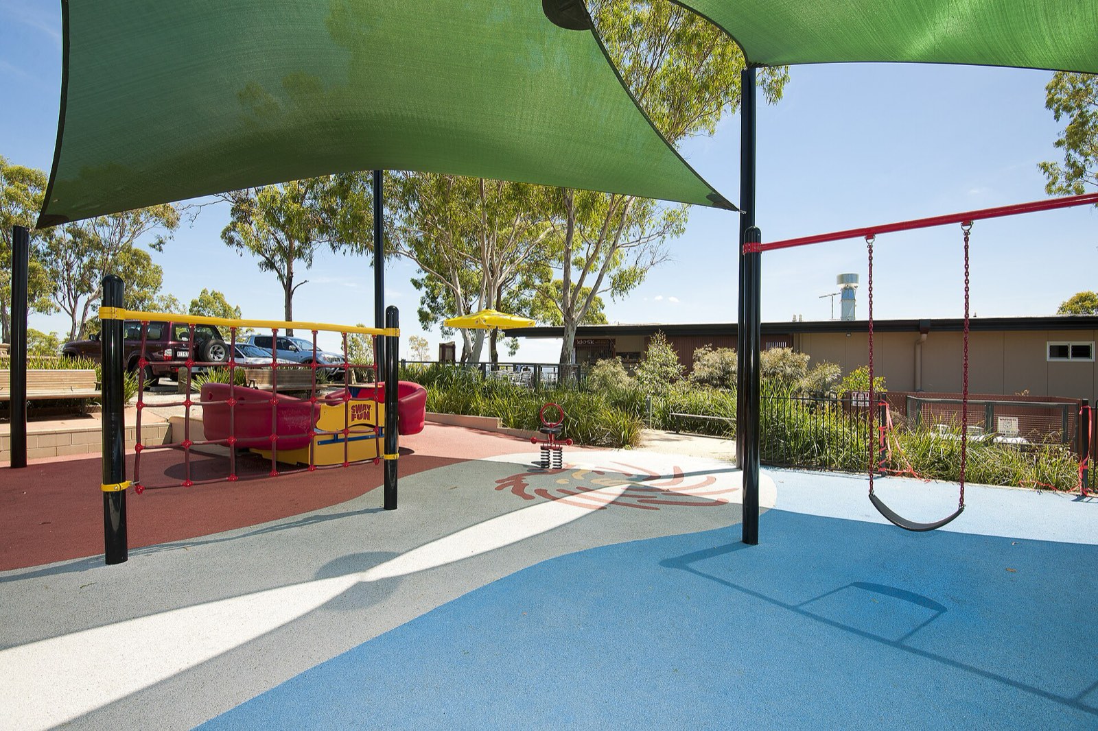 Mt Gravatt Outlook Playground: Green shade sails over swings and spinner